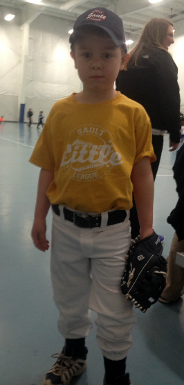 Inside or outside, Brian is happy baseball has started. He insisted on wearing his full uniform for practice!